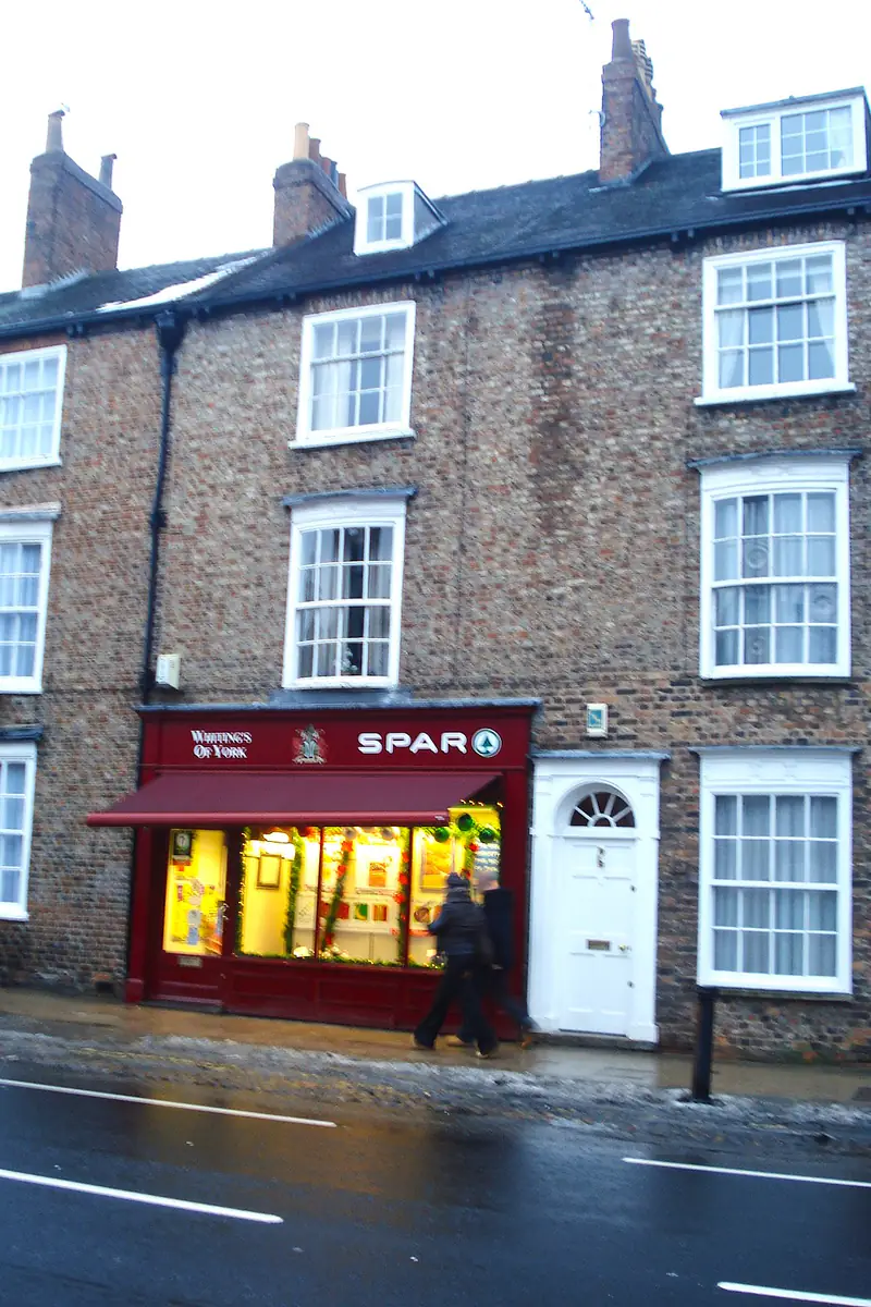 Grade II listed Georgian terrace in York with an incongruous 1990s shopfront, prior to heritage restoration works