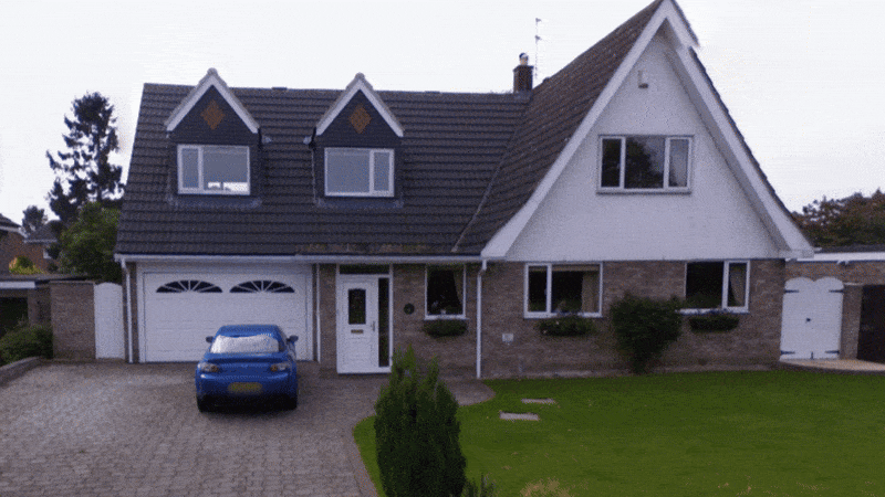 An animated before-and-after sequence showing the transformation of a traditional brick house into a modern 4-bedroom replacement dwelling in Copmanthorpe, York. The new design features a crisp render finish, modern PPC aluminium windows , and a new central glazed section
