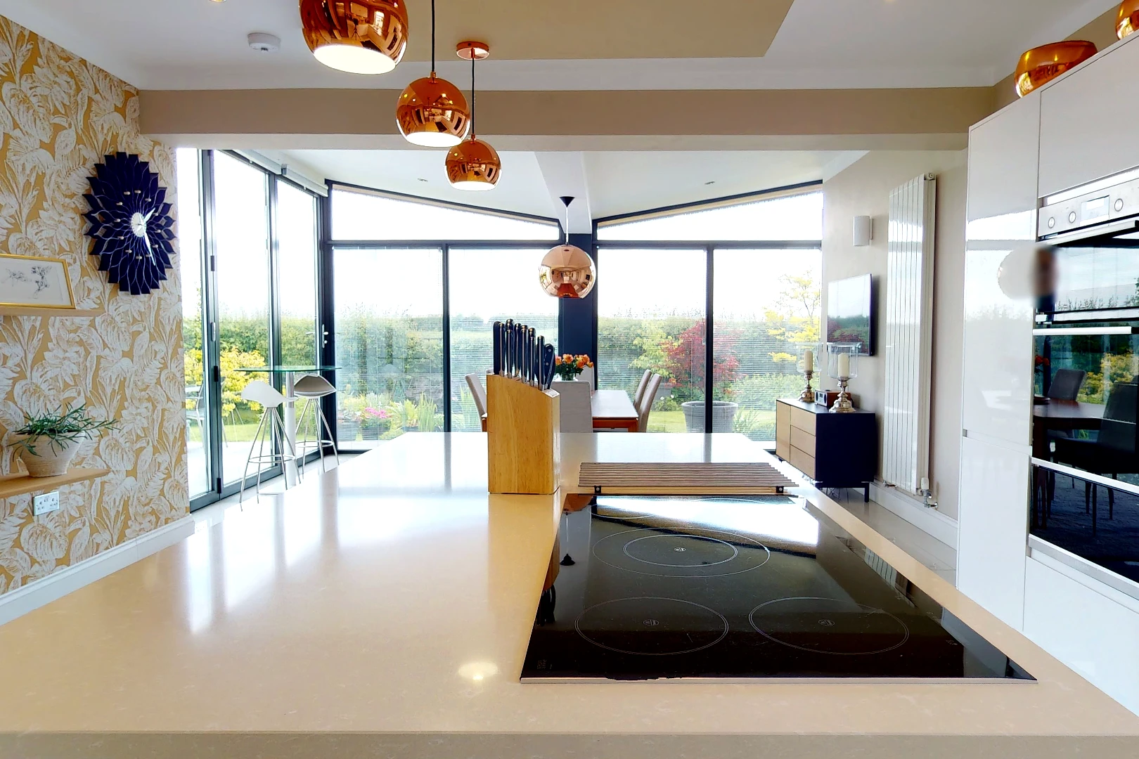 Contemporary Extension Open Plan Kitchen Diner Garden Views and Brightly Lit Monolithic Kitchen Island with Copper Fixtures
