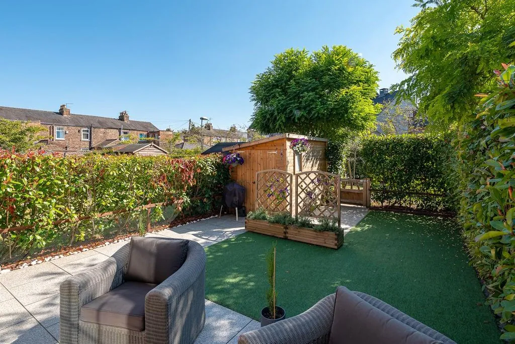 Private ground-floor garden and patio area at Bootham Green, showing contemporary fencing and modern landscaping alongside the restored Victorian school conversion.
