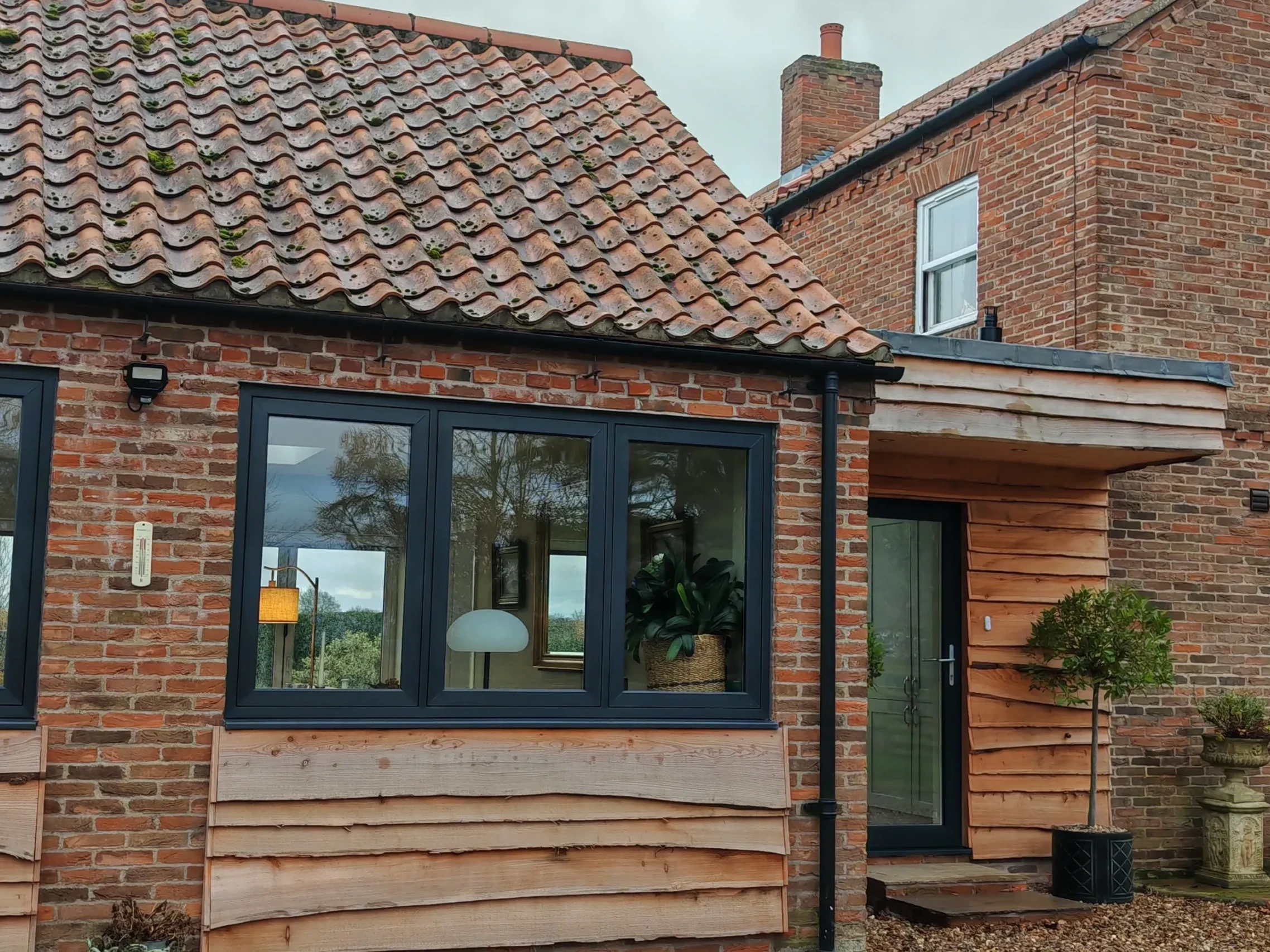 Garage conversion adapting the exisitng garage bay openings, in Nether Poppleton, York, North Yorkshire