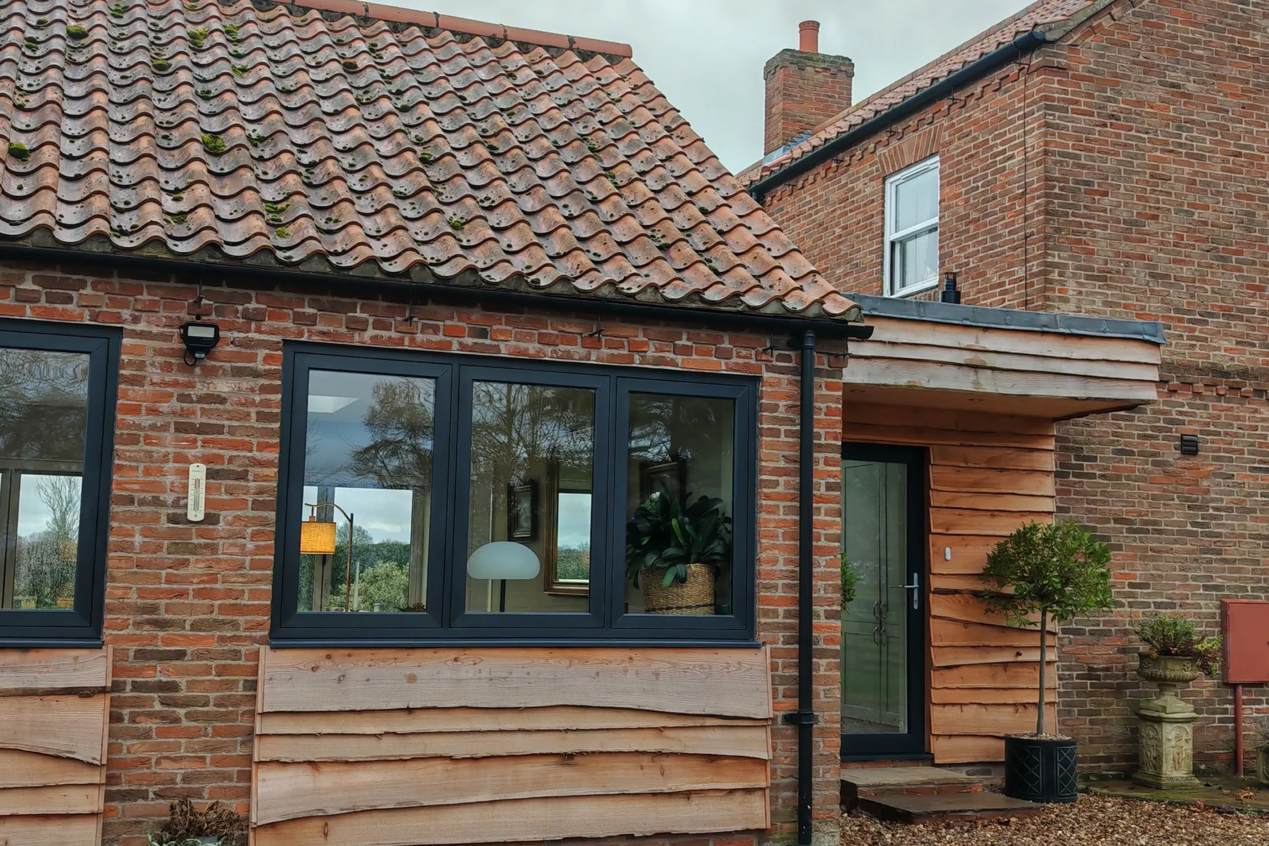 Garage conversion adapting the exisitng garage bay openings, in Nether Poppleton, York, North Yorkshire