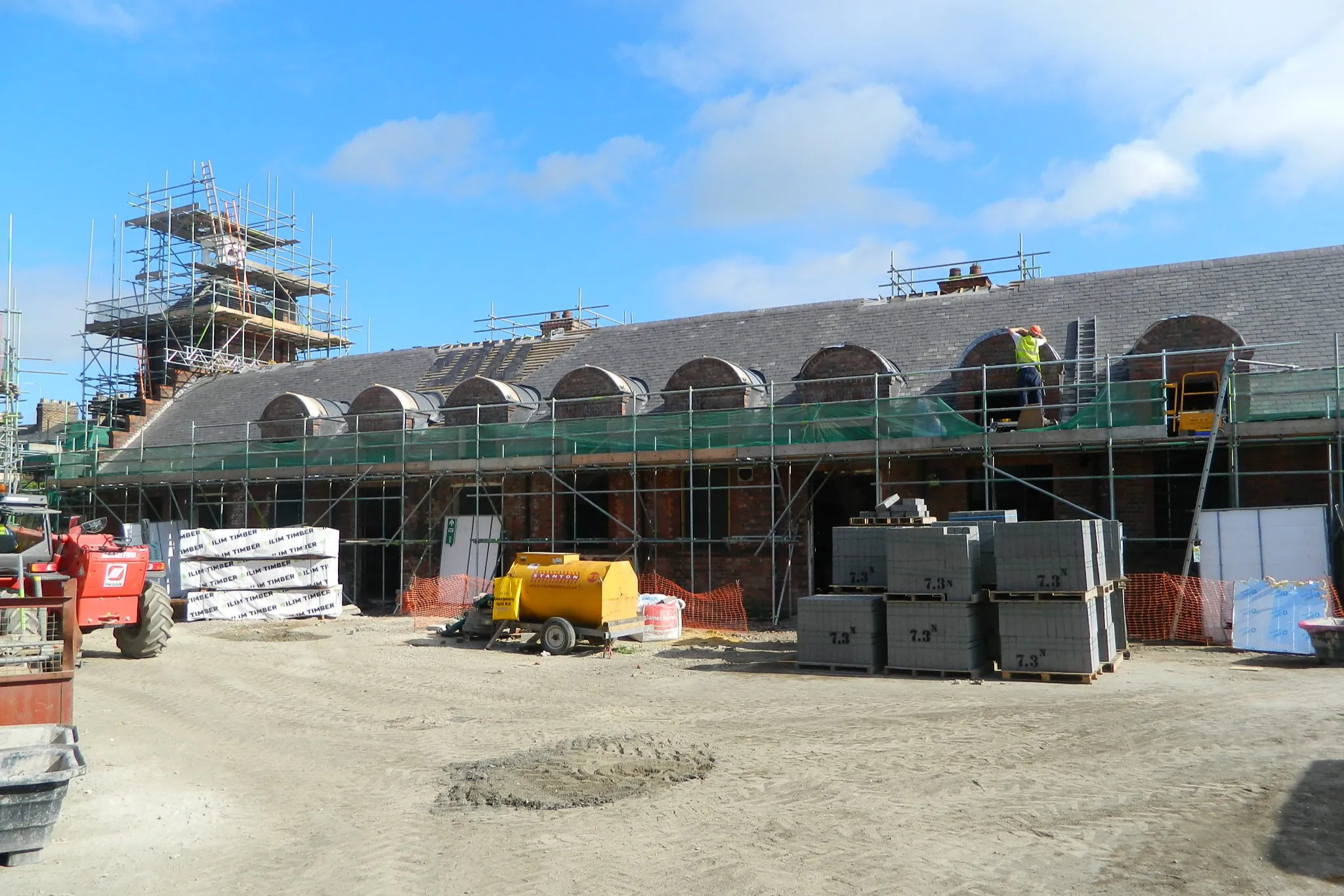 Scaffolding and construction materials on-site at Shipton Street School in York during the heritage-led regeneration and restoration of the original 1890s brickwork.