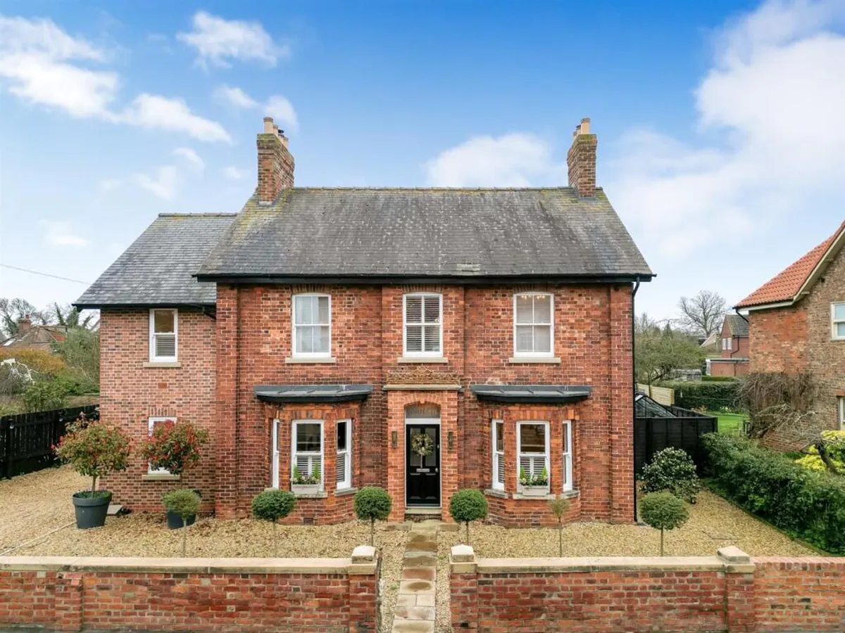 Restored front elevation of a Victorian detached property on Alne Road in the Tollerton Conservation Area, showing reinstated handmade timber sash windows replacing unsympathetic contemporary glazing, designed by Fining Associates Chartered Architects for Hambleton District Council planning approval