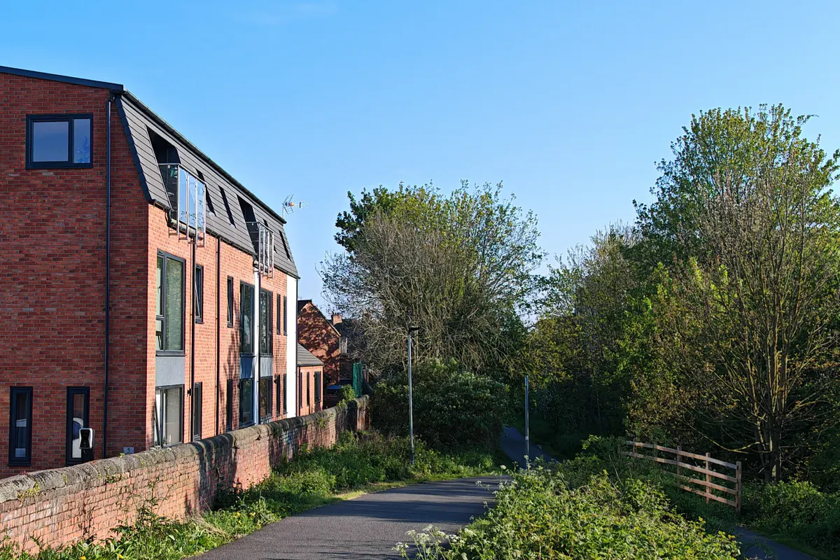 Hawthorn Street Apartments viewed along the Foss Islands traffic-free cycleway, York, demonstrating the development's active travel credentials with direct cycleway frontage and secure cycle storage for 14 bikes on this sustainable, car-light brownfield scheme.