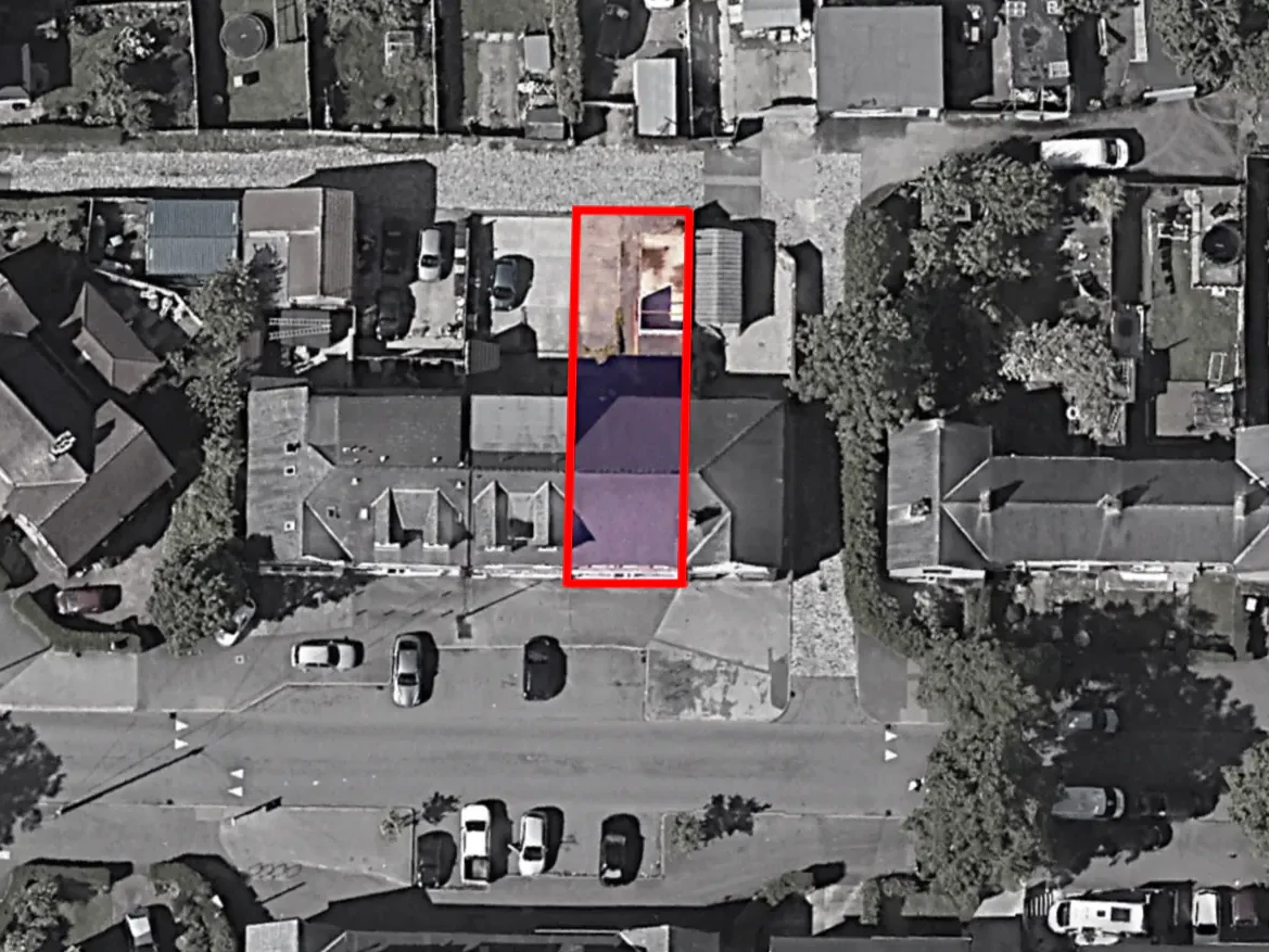 Aerial view of a neighbourhood shopping parade in York with the mixed-use conversion site outlined in red