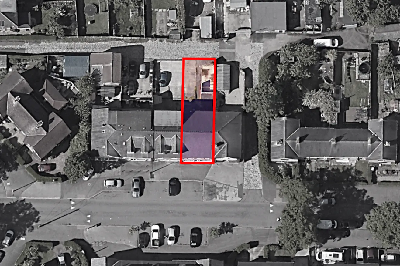 Aerial view of a neighbourhood shopping parade in York with the mixed-use conversion site outlined in red